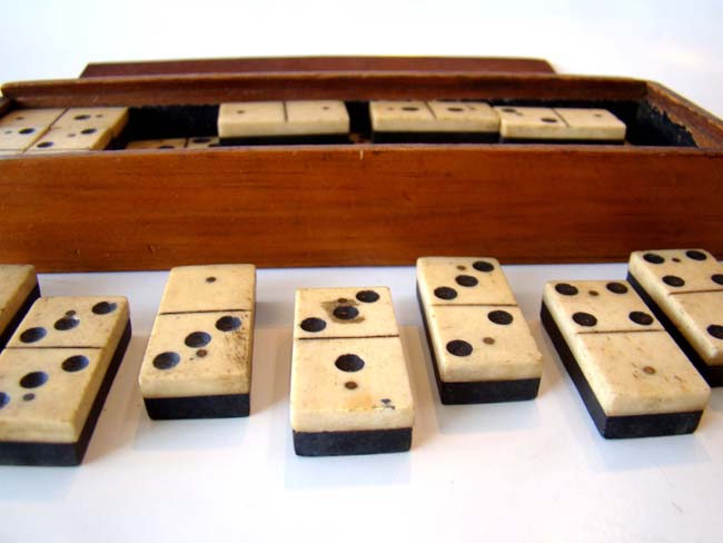 A complete set of Civil War era (circa 1865) bone and ebony dominoes.